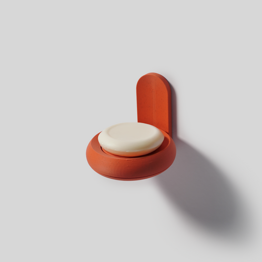 Wall-mounted SLOY soap holder in terracotta with soap bar on