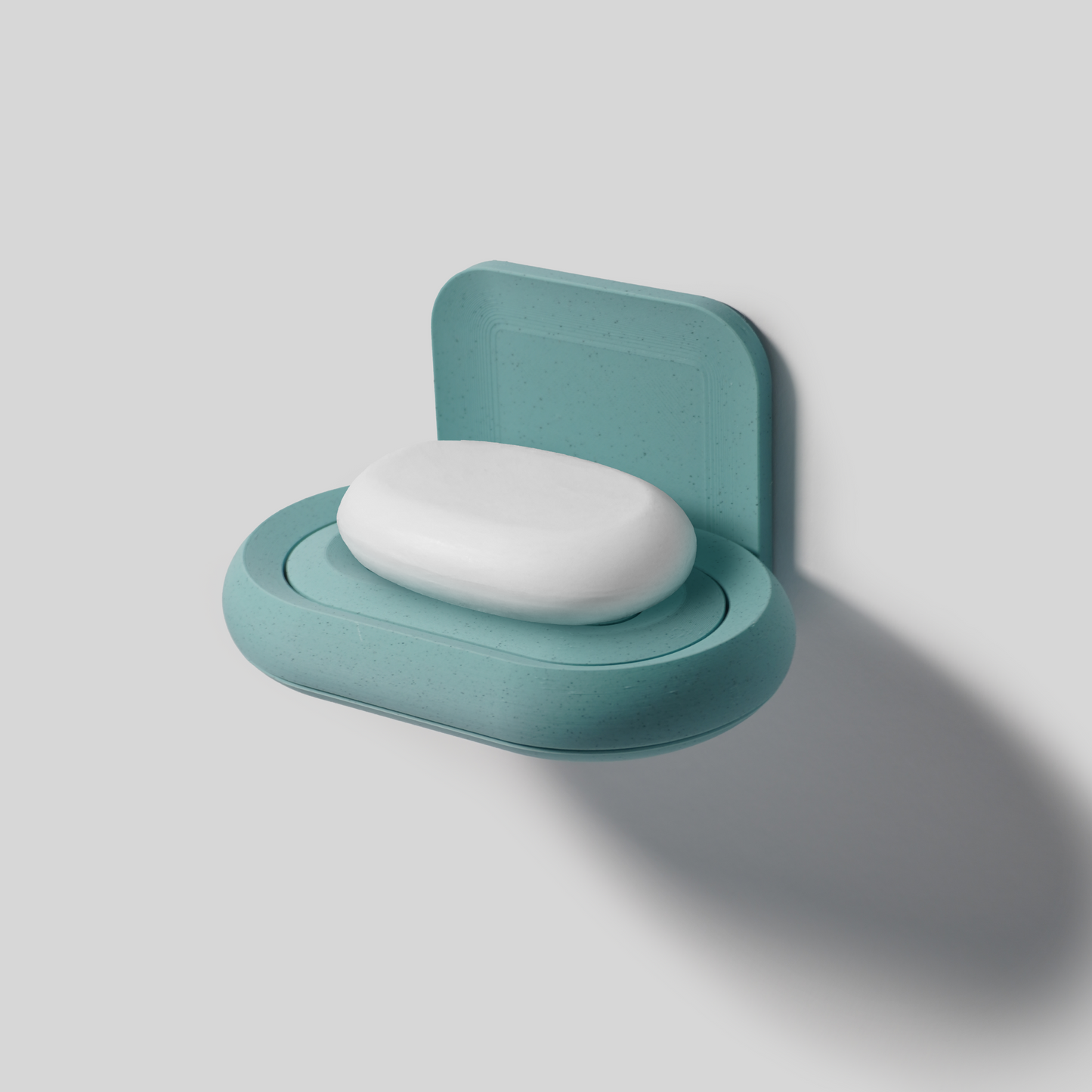 Teal soap holder PLA with a white soap bar on a light gray background