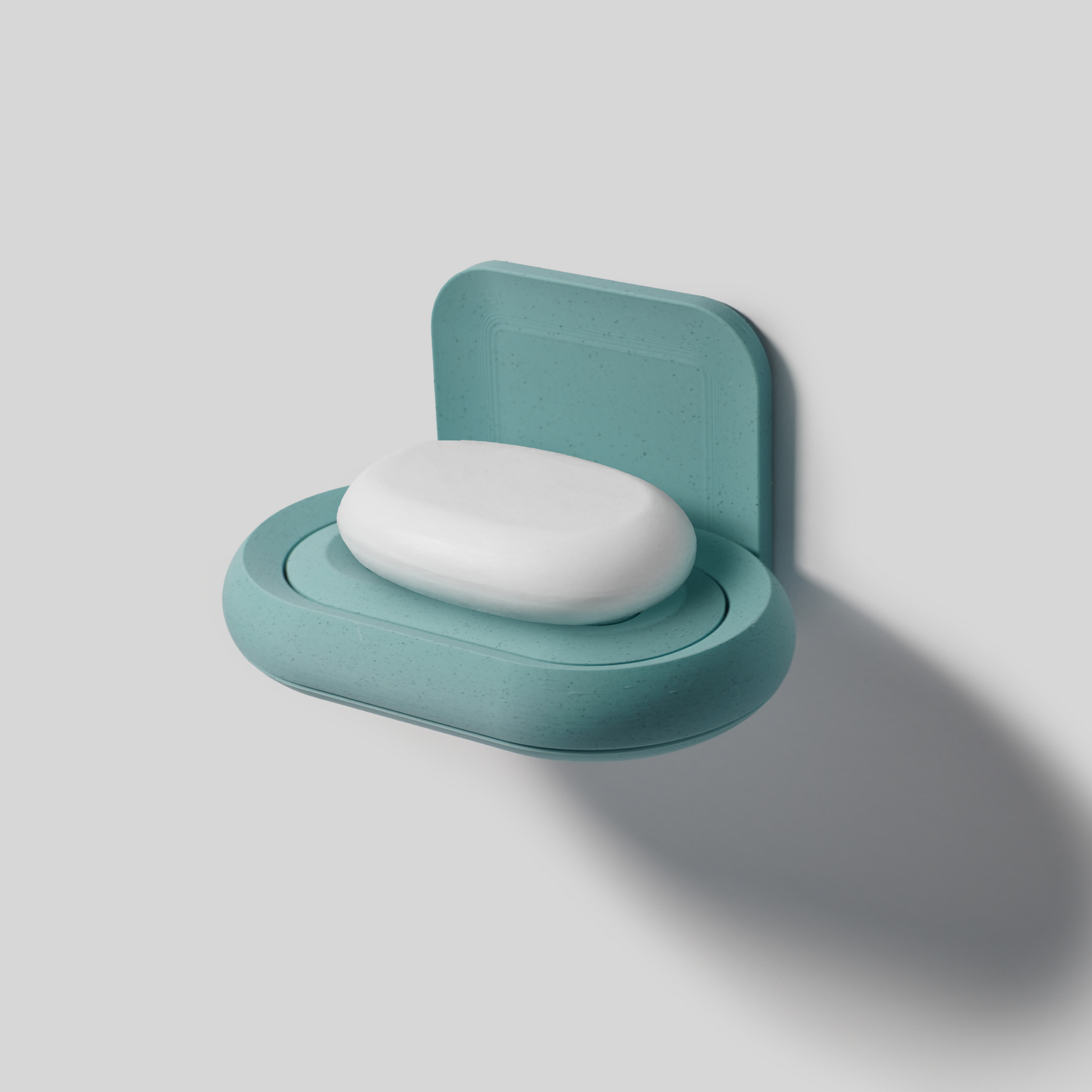 Teal soap holder PLA with a white soap bar on a light gray background