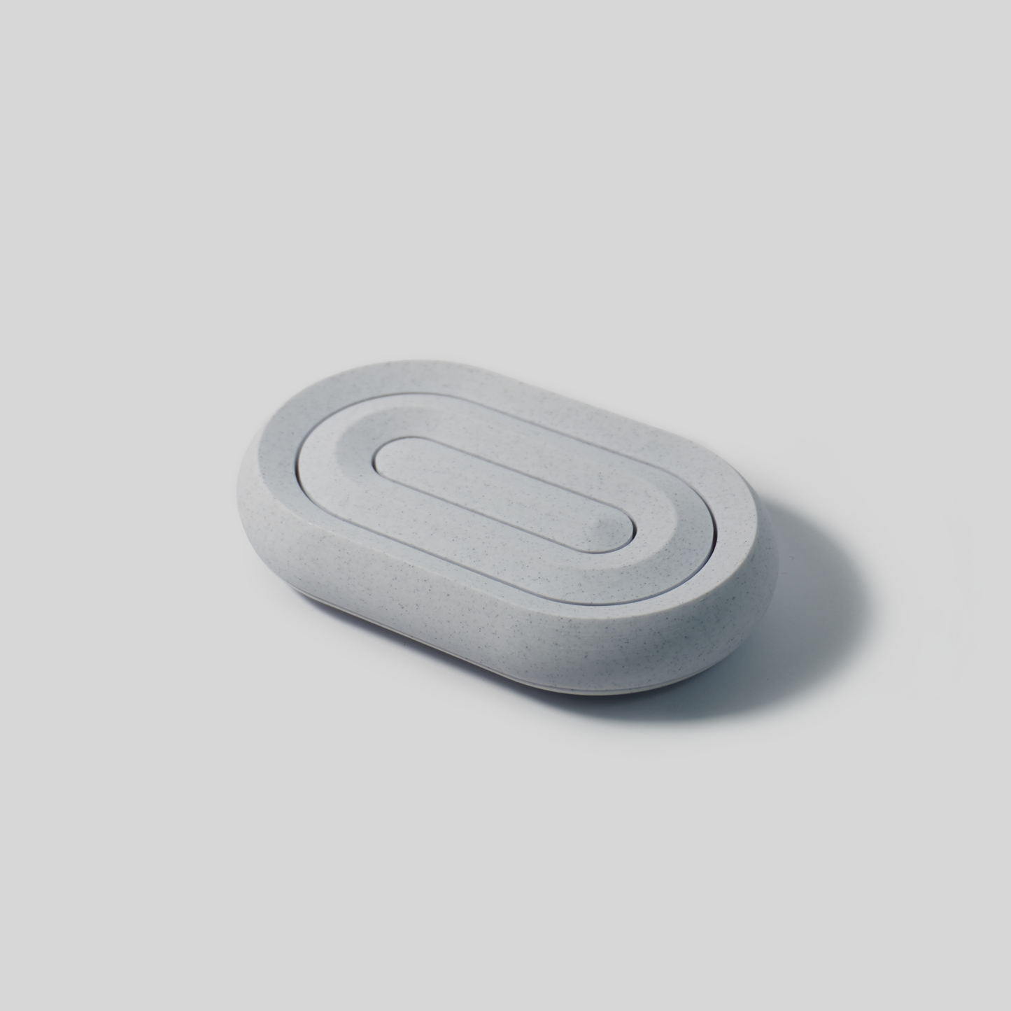 Gray long hole soap holder on a light gray background