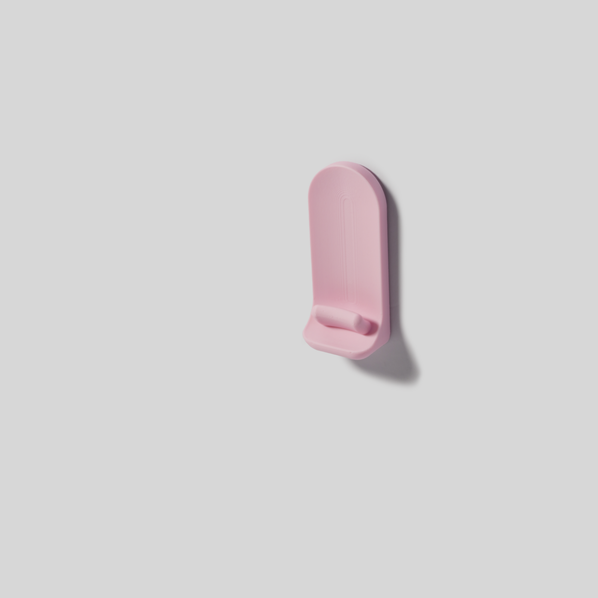 pastel Pink wall mount on a light gray background
