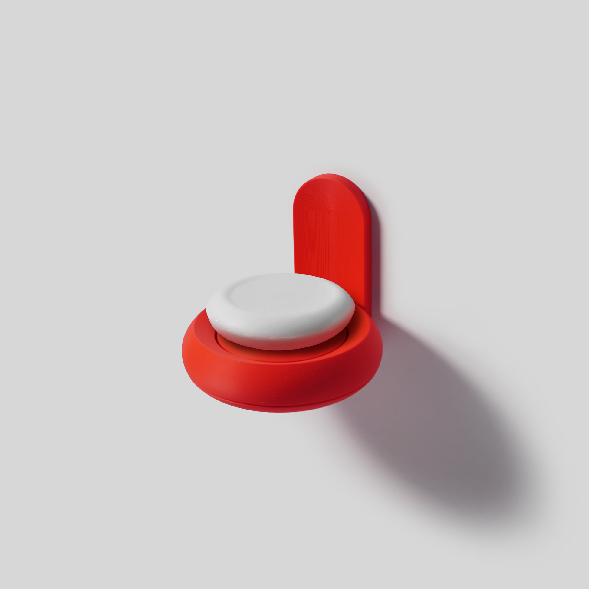 Red wall-mounted soap holder with a white circular soap on a light gray background PLA 3D printed