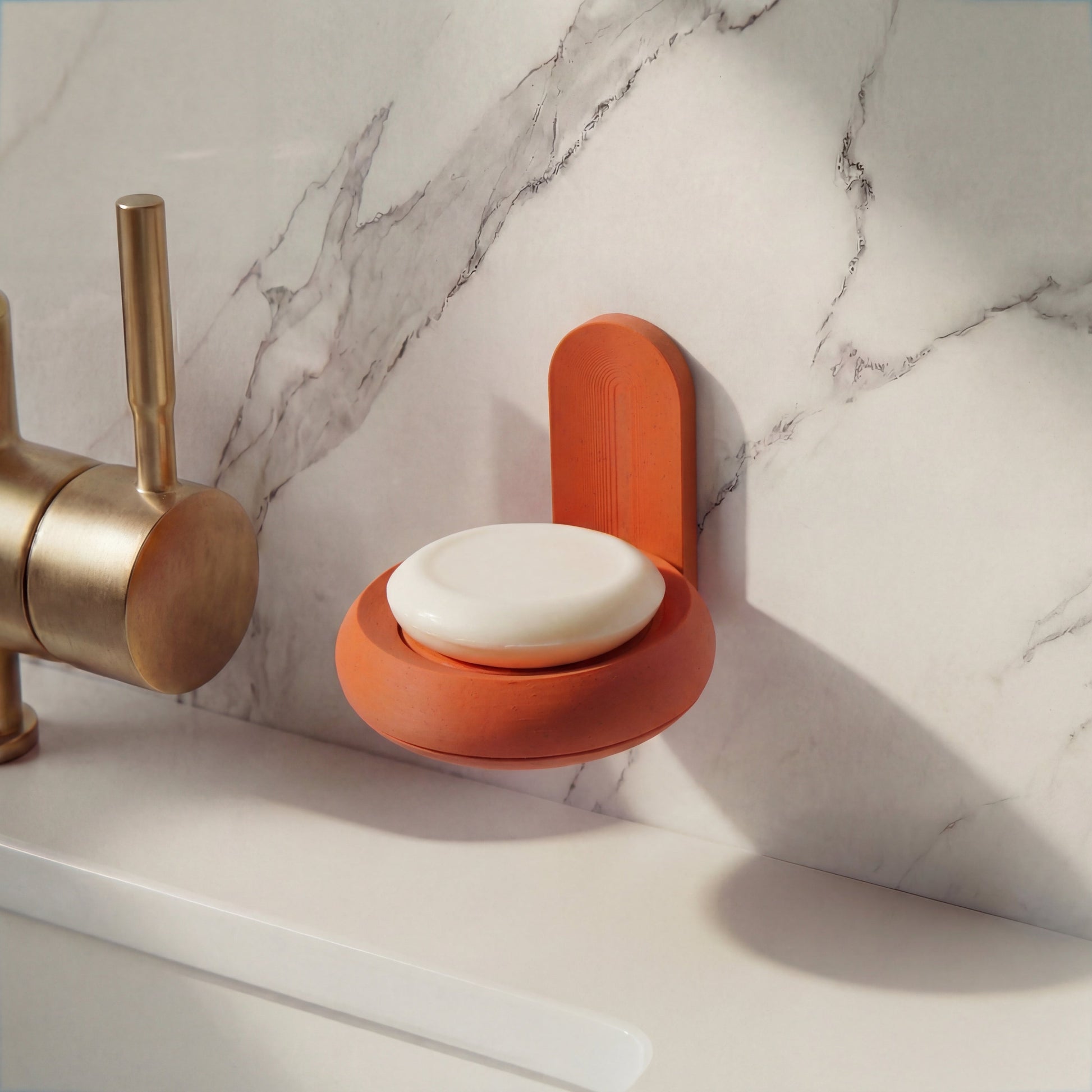 Soap holder with organic soap bar in modern marble bathroom