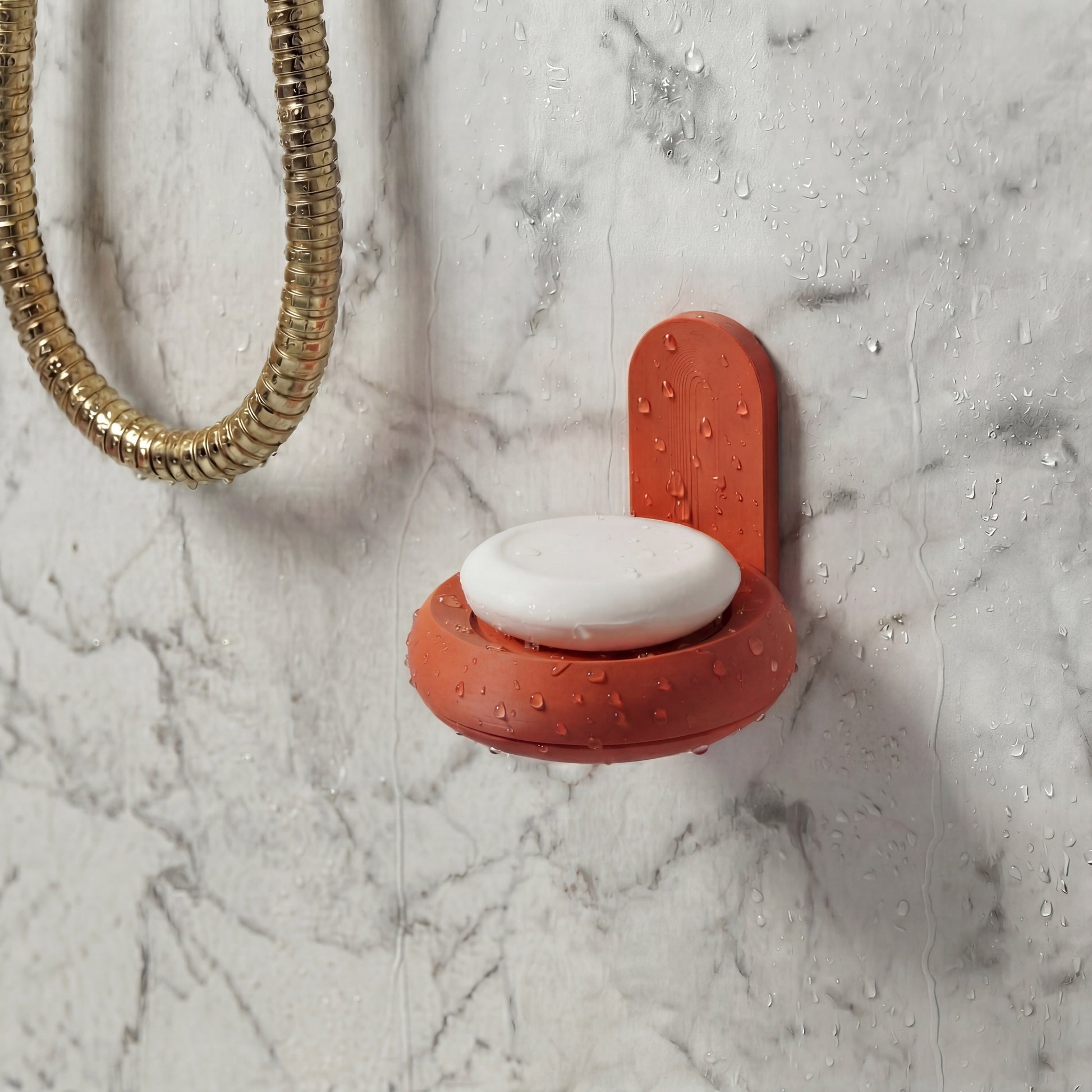 Terracotta soap holder with natural soap mounted in shower