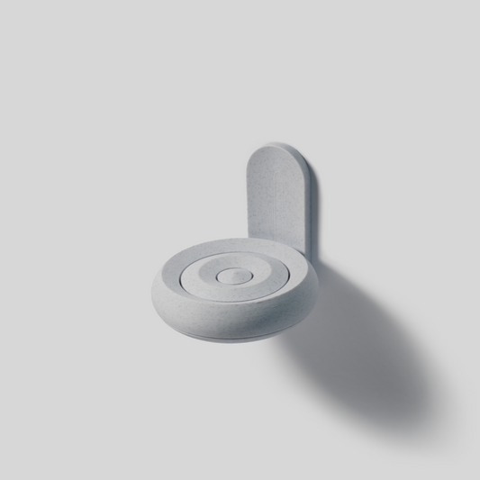Gray soap holder wall mounted with adhisive on a light gray background