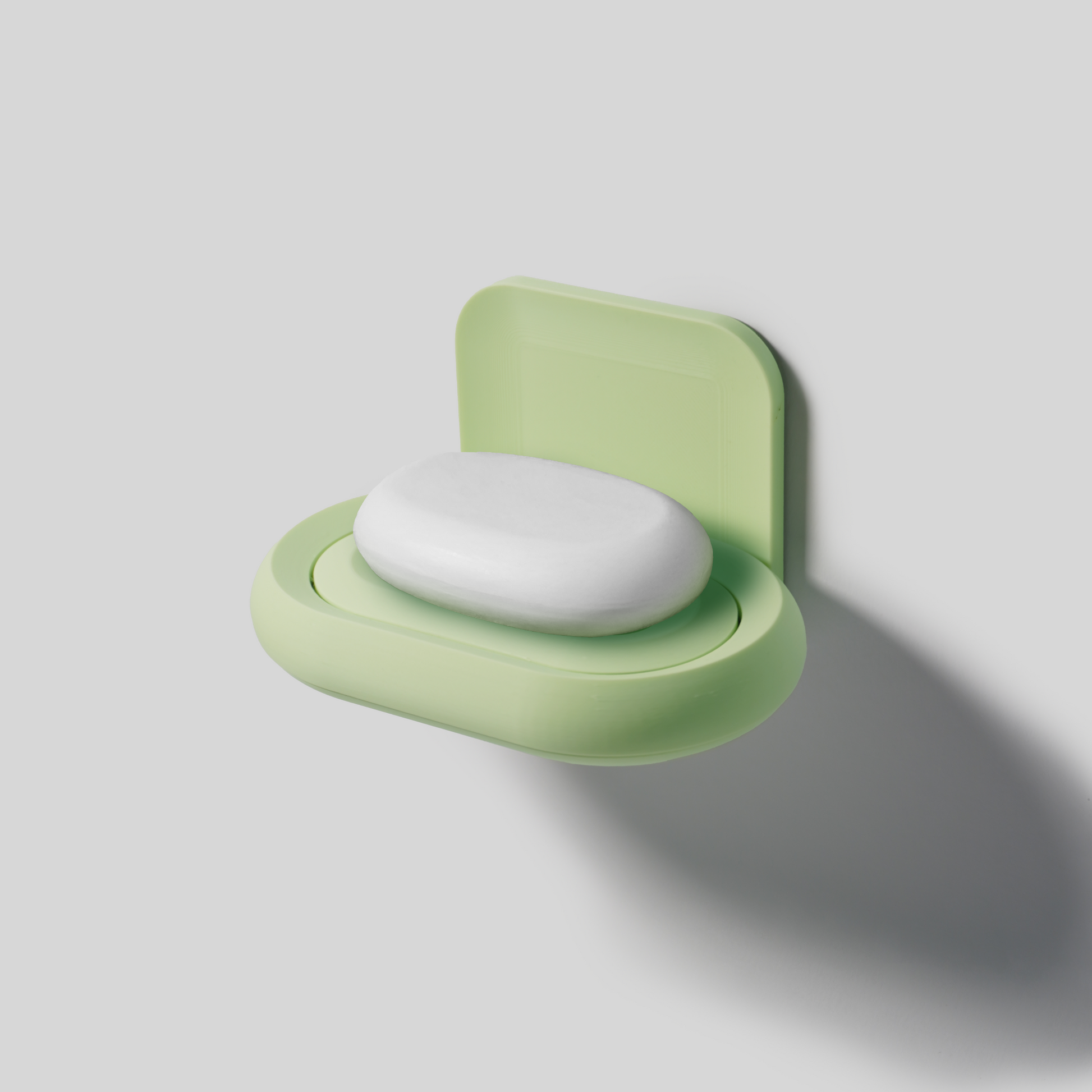 mint Green soap holder with a bar of soap on a light gray background