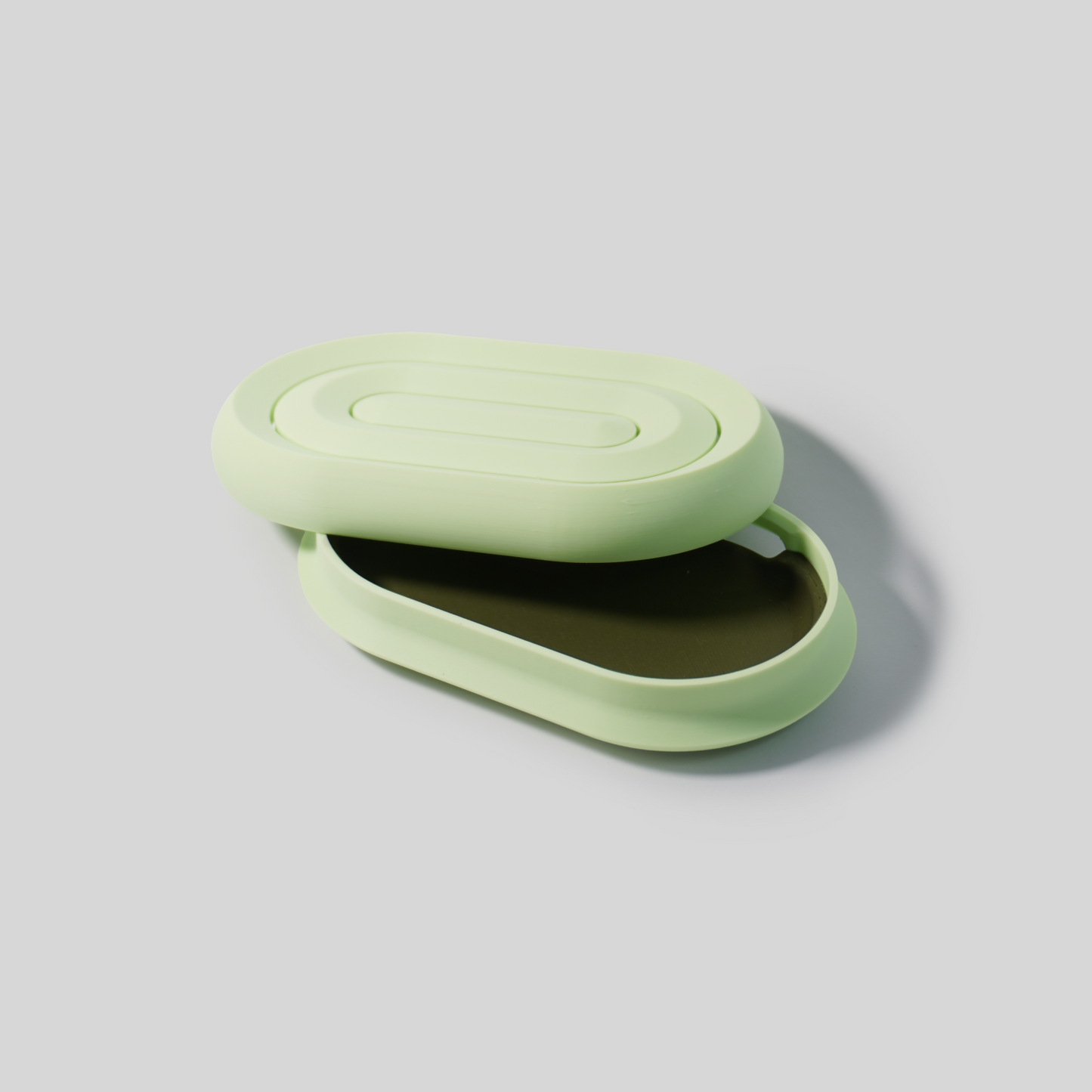 mint Green open soap holder on a light gray background