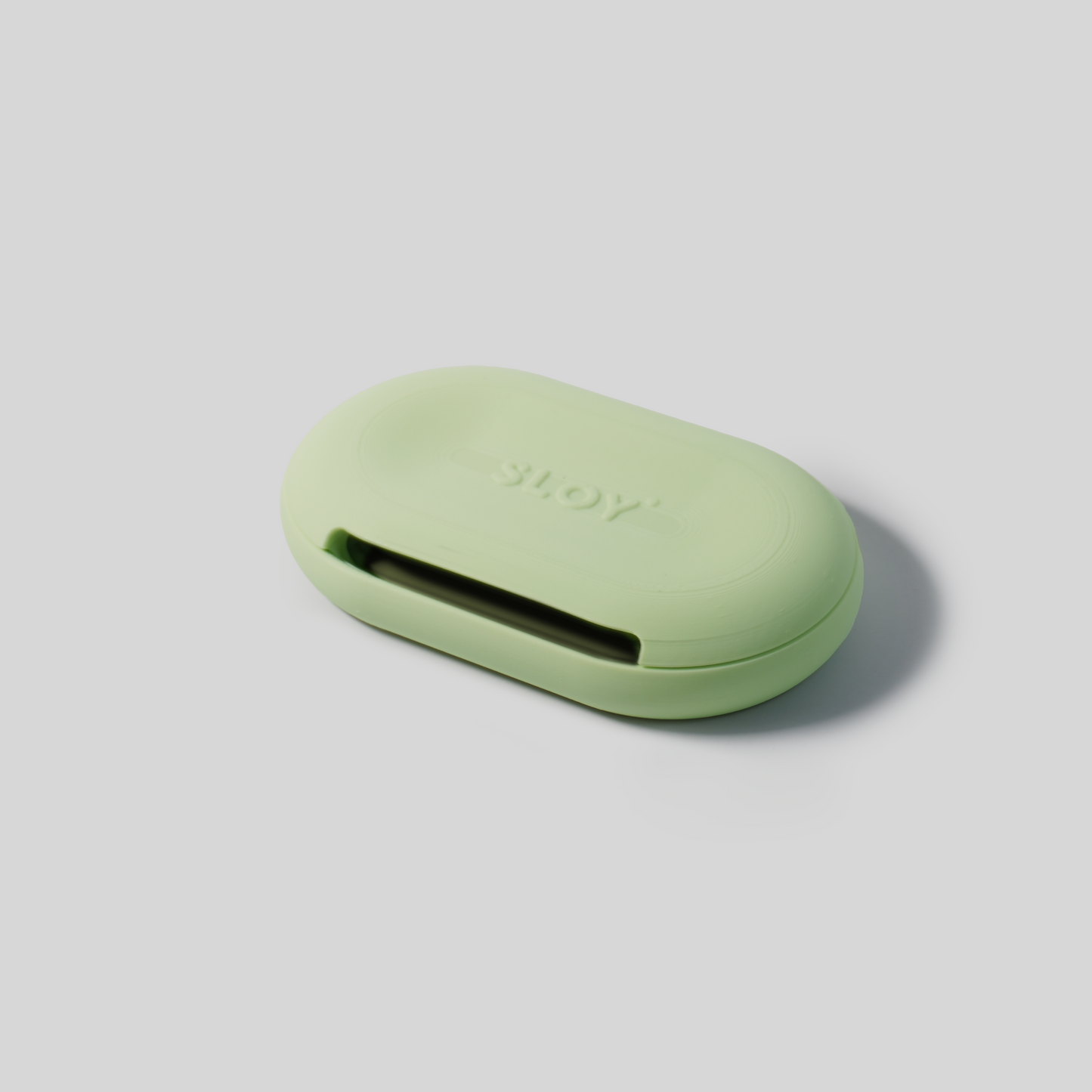 mint Green soap holder upside down with 'SLOY' branding on a light gray background